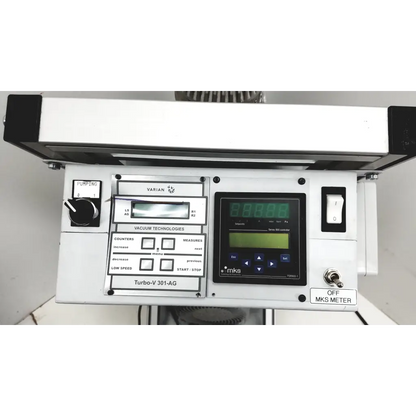 White industrial control panel with digital displays and labeled buttons on turbo-v 301-ag navigator vacuum pump system