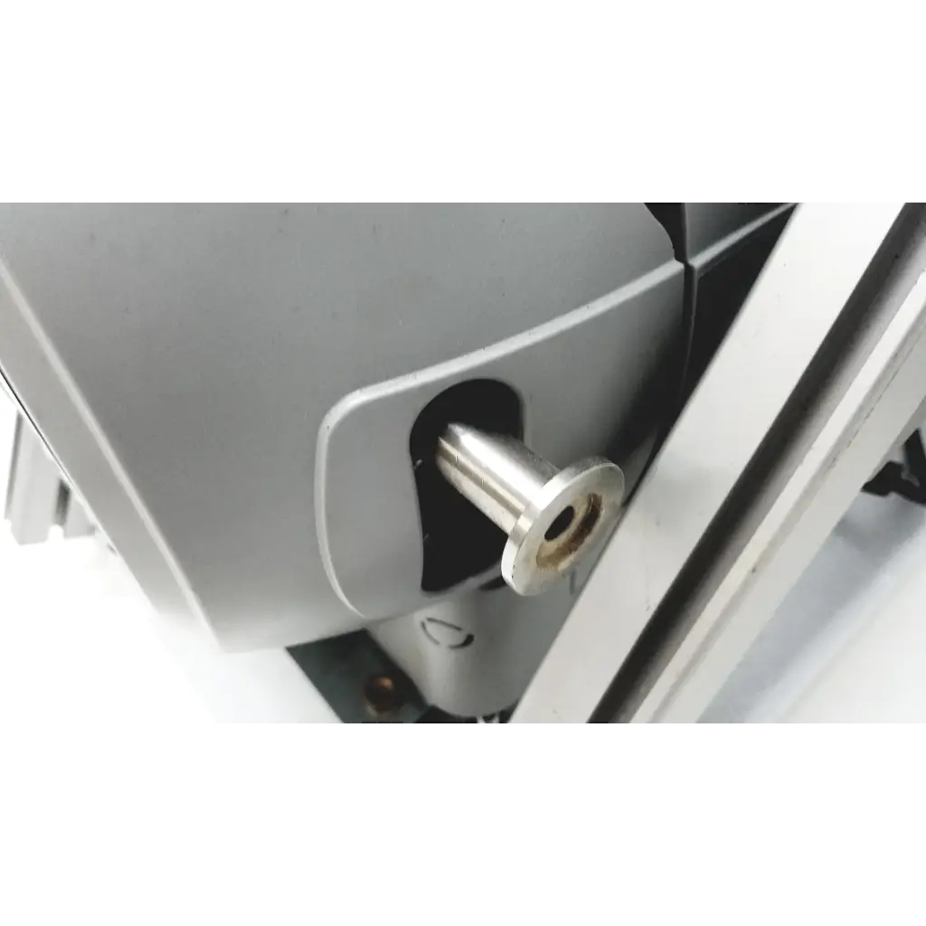 A polished silver metallic bolt on the side of the gray varian turbo-v 301-ag navigator vacuum pump system