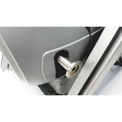 A polished silver metallic bolt on the side of the gray varian turbo-v 301-ag navigator vacuum pump system