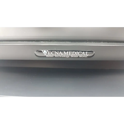 Silver metallic plaque with vecna medical logo on a medical kiosk featuring elo ac adapter da-150a12