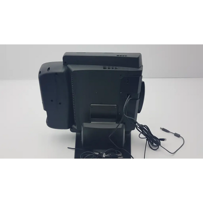 Black plastic touchscreen cash register medical kiosk by vecna medical with integrated receipt printer and elo ac adapter connections