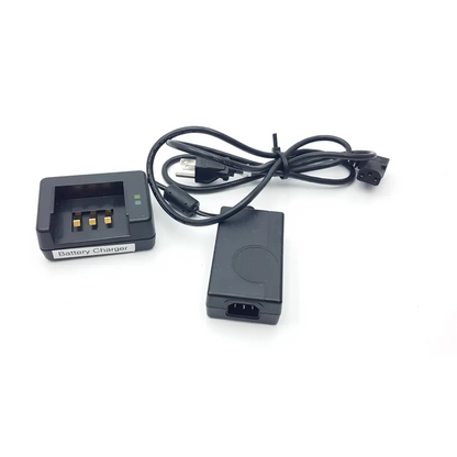 Black plastic verathon bladder scan bvi3000 battery charger with gold contacts and coiled cable with power adapter