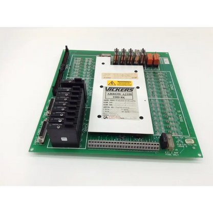 Green printed circuit board pcb-fsc-471-95 with white vickers arrow a2100 module and various connectors and components