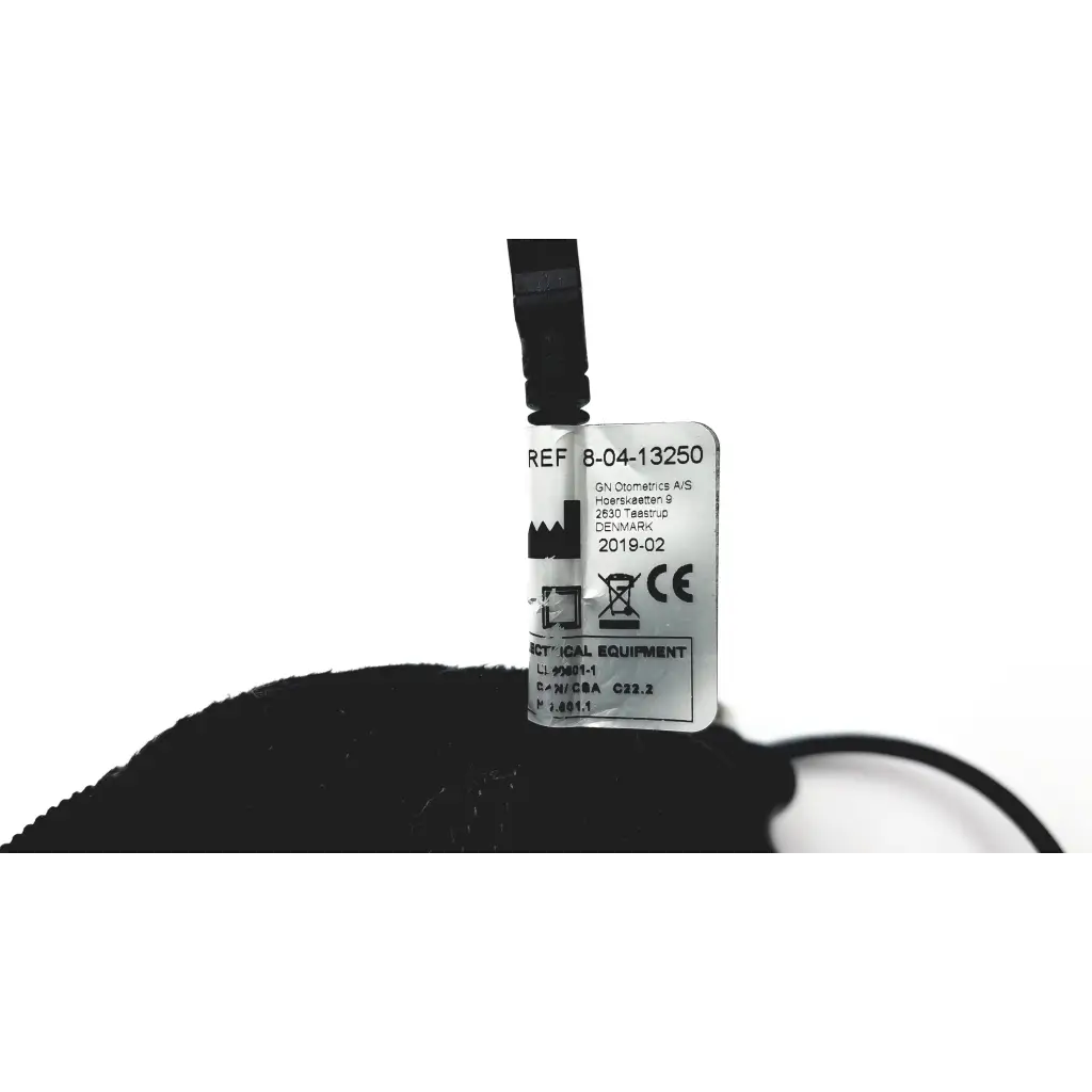 White rectangular label with black text and symbols attached to black cable of video otoscope otocam 300 g-bbhc3-1 model