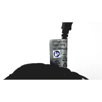 Silver rectangular label with black printed text on the back of video otoscope otocam 300 medical device