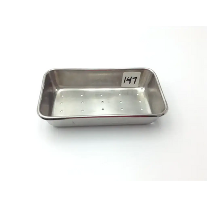 Vollrath stainless steel perforated rectangular instrument tray with rounded corners and perforated bottom