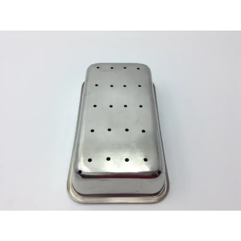 Vollrath stainless steel perforated rectangular instrument tray with evenly spaced holes for medical use
