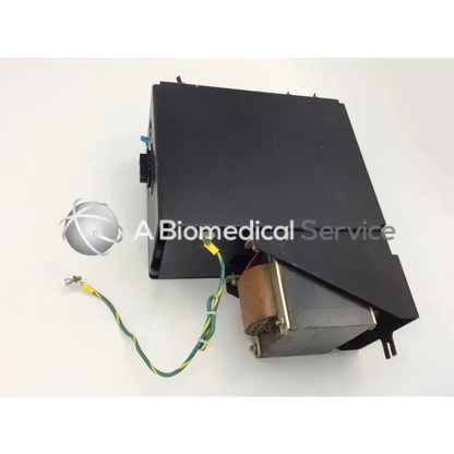 Black rectangular voltage dist assembly with silver spherical component and green yellow wiring for 208v 60 hz 1 phase