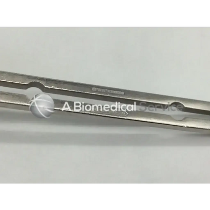 Weck stainless abdominal retractor with silver surgical forceps metallic finish and precise rounded tips
