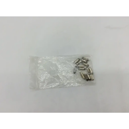 A clear plastic bag containing small metallic cylindrical pins for welch allyn transilluminator bulb ad5-326