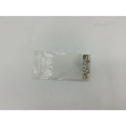 A clear plastic bag containing several small silver metallic welch allyn transilluminator bulb ad5-326 components