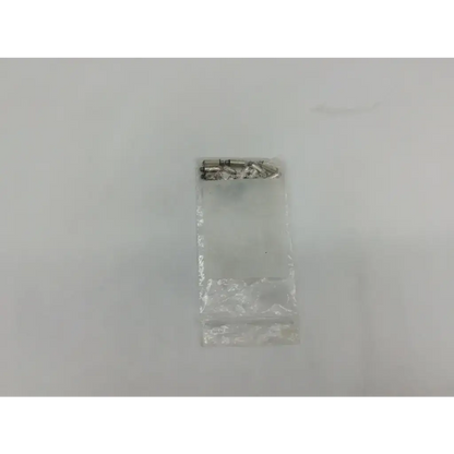 A clear plastic bag with several small metallic silver screws for welch allyn transilluminator bulb ad5-326