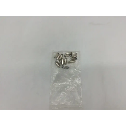 A clear plastic bag containing multiple small metallic silver welch allyn transilluminator bulb ad5-326 cylinders