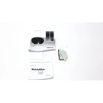 White plastic welch allyn dental handpiece with black interior and silver accents for exam light wall holder use
