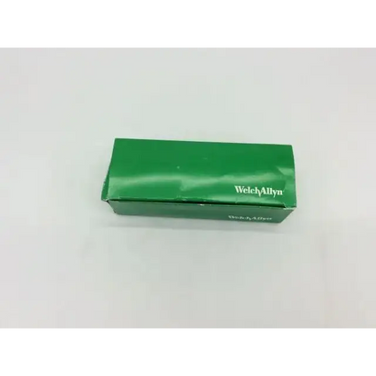 Green rectangular welch allyn box containing mac fiber optic laryngoscope blade for medical use
