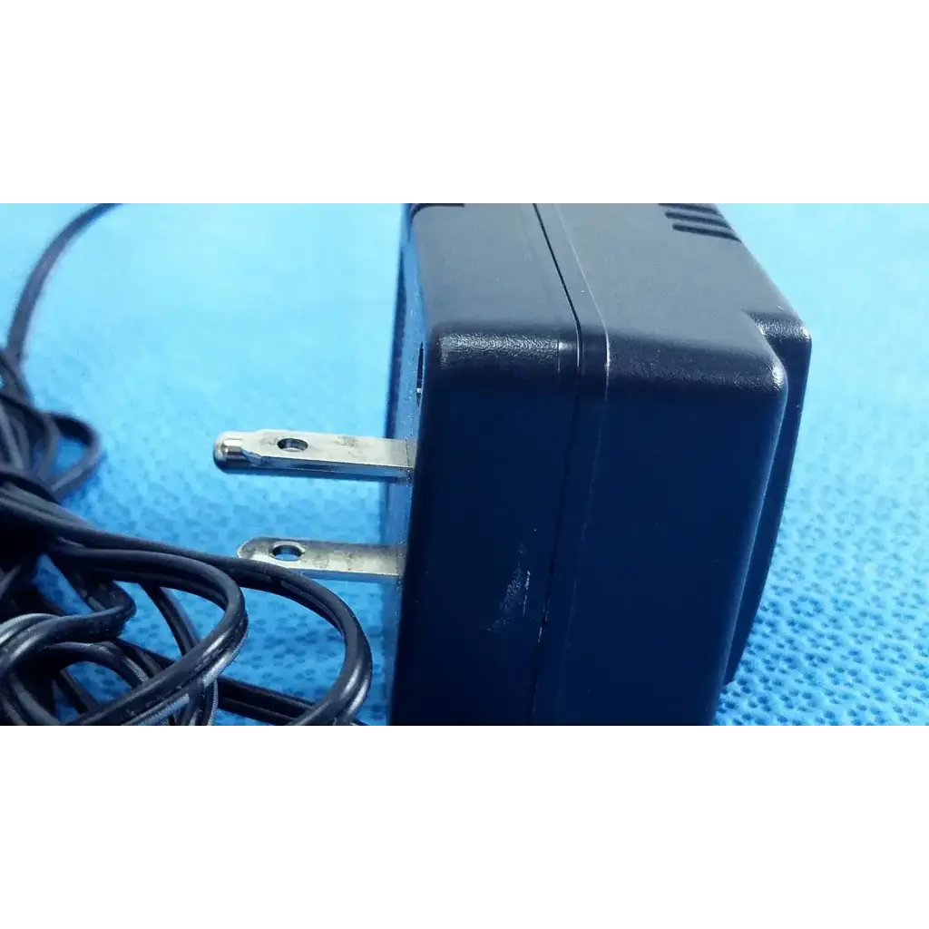 Welch allyn 71040 black plastic transformer adapter power supply with silver prongs and coiled power cord 120v 60hz 50ma