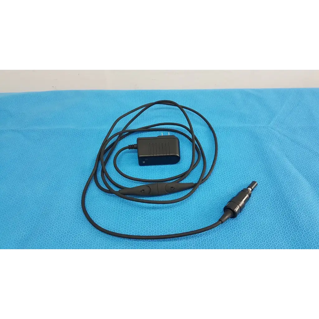 Black coiled cable with rectangular power adapter plug for welch allyn 73305 6v medical device power adapter