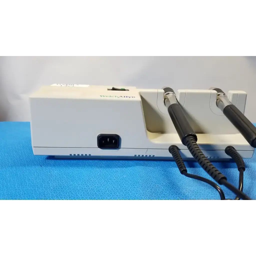 Welch Allyn 767 otoscope wall transformer with white metal unit two black-handled probes and coiled cords for diagnostics