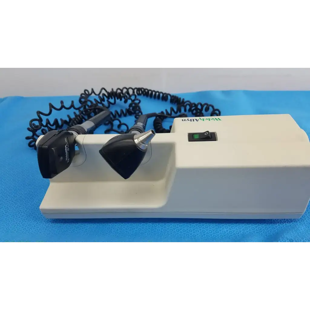 White medical otoscope with black and silver attachments and coiled cord for welch allyn 767 series wall transformer
