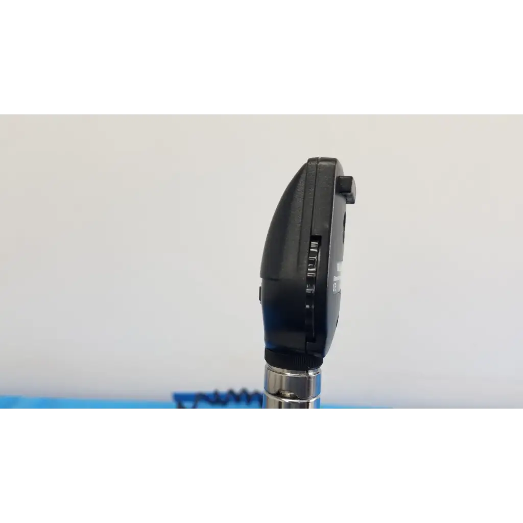 Black plastic otoscope with silver metallic stem as part of welch allyn 767 series wall transformer set