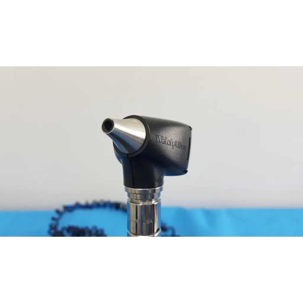 Black and silver welch allyn otoscope with metallic tip and ergonomic handle for 767 series wall transformer use