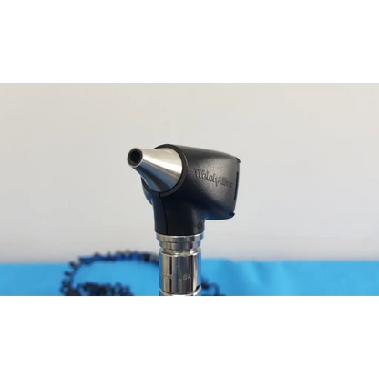 Black and silver welch allyn otoscope with metallic tip and ergonomic handle for 767 series wall transformer use