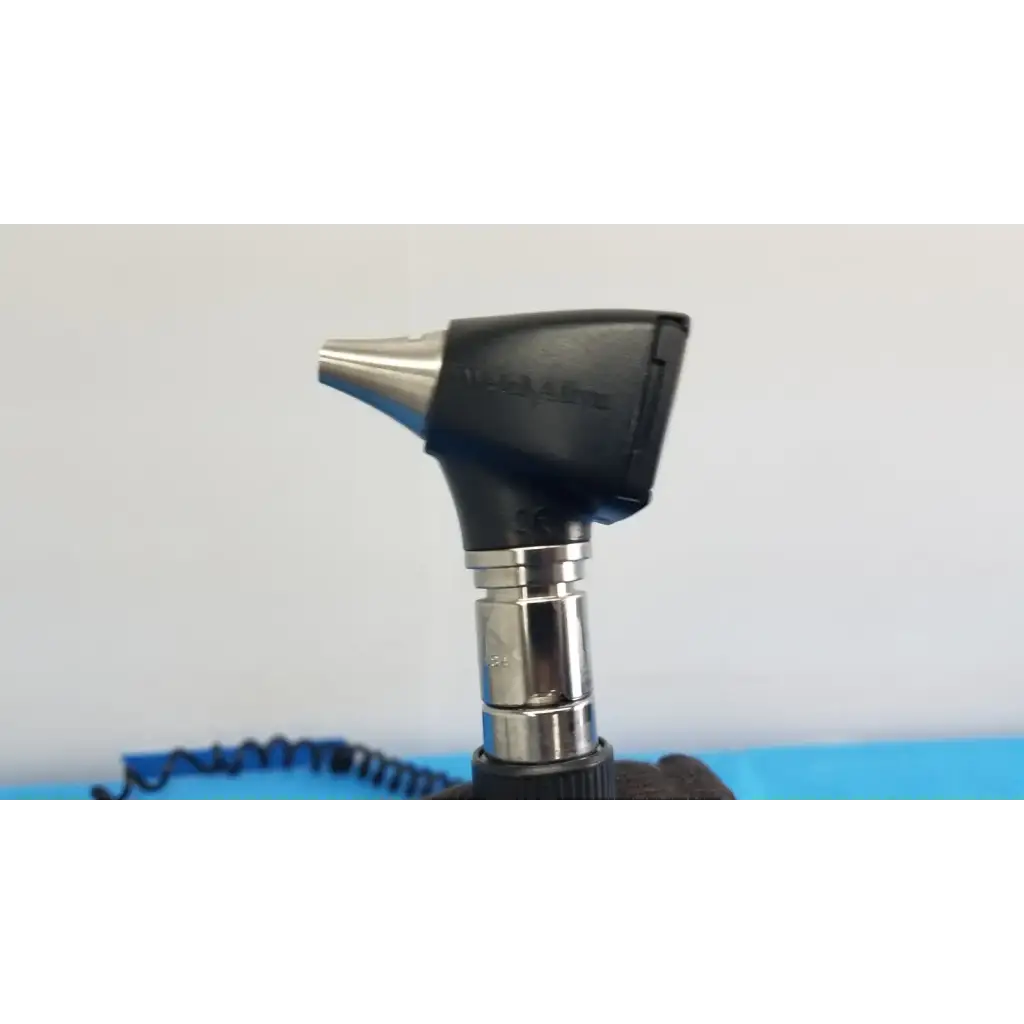 Black and silver otoscope with sleek ergonomic design in welch allyn 767 series wall transformer medical set