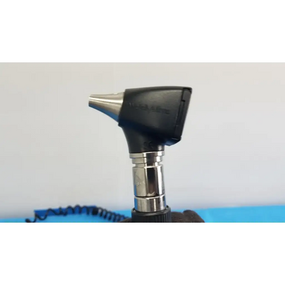 Black and silver otoscope with sleek ergonomic design in welch allyn 767 series wall transformer medical set
