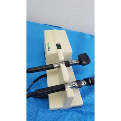 White medical otoscope with black handles and silver joints branded medialpin in welch allyn 767 series wall transformer