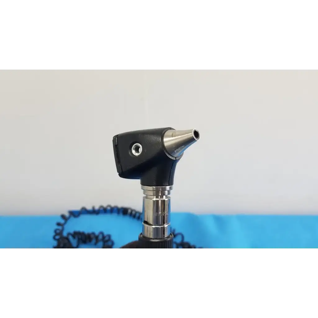 Black and silver welch allyn 767 series wall transformer otoscope with textured grip metallic tip and coiled cable