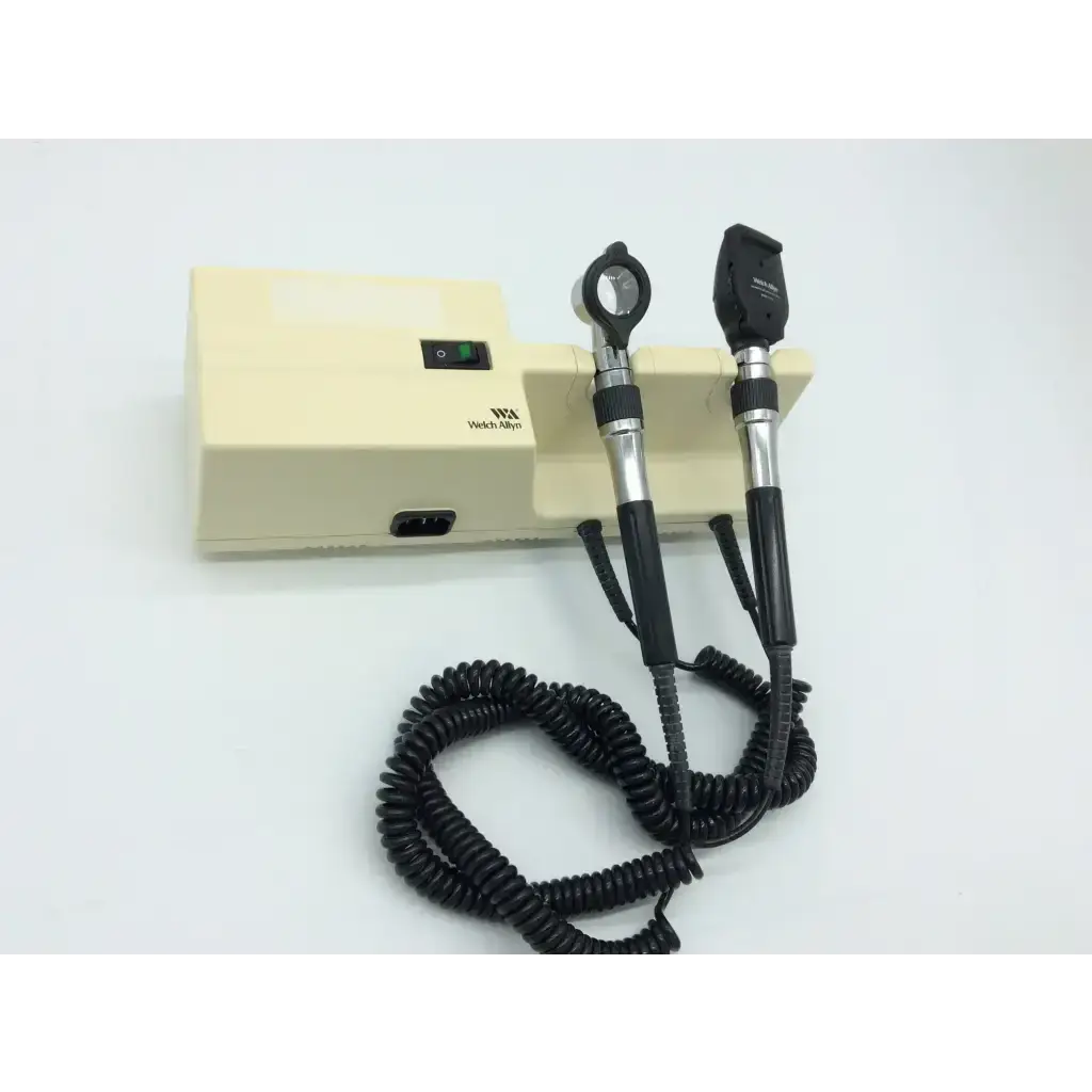 Beige welch allyn ophthalmoscope with black silver handles and coiled black cables for series wall transformer use