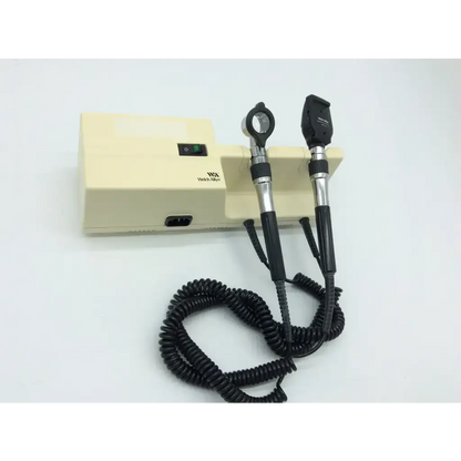 Beige welch allyn ophthalmoscope with black silver handles and coiled black cables for series wall transformer use