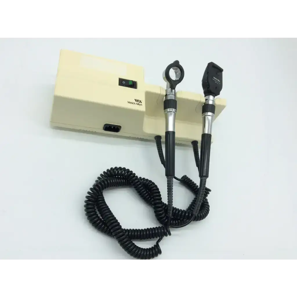 Beige and black welch allyn 767 series wall transformer with ophthalmoscope and compact coiled cord power unit