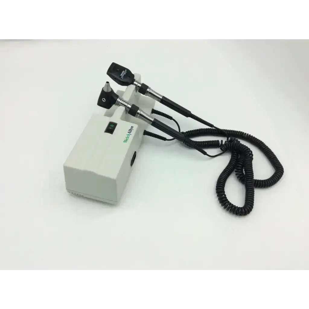 White rectangular welch allyn wall transformer 25020a with two black articulated arms and coiled cables featuring green logo