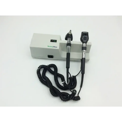 Welch allyn 767 wall transformer 25020a otoscope with black silver handles connected to white power unit by coiled cable