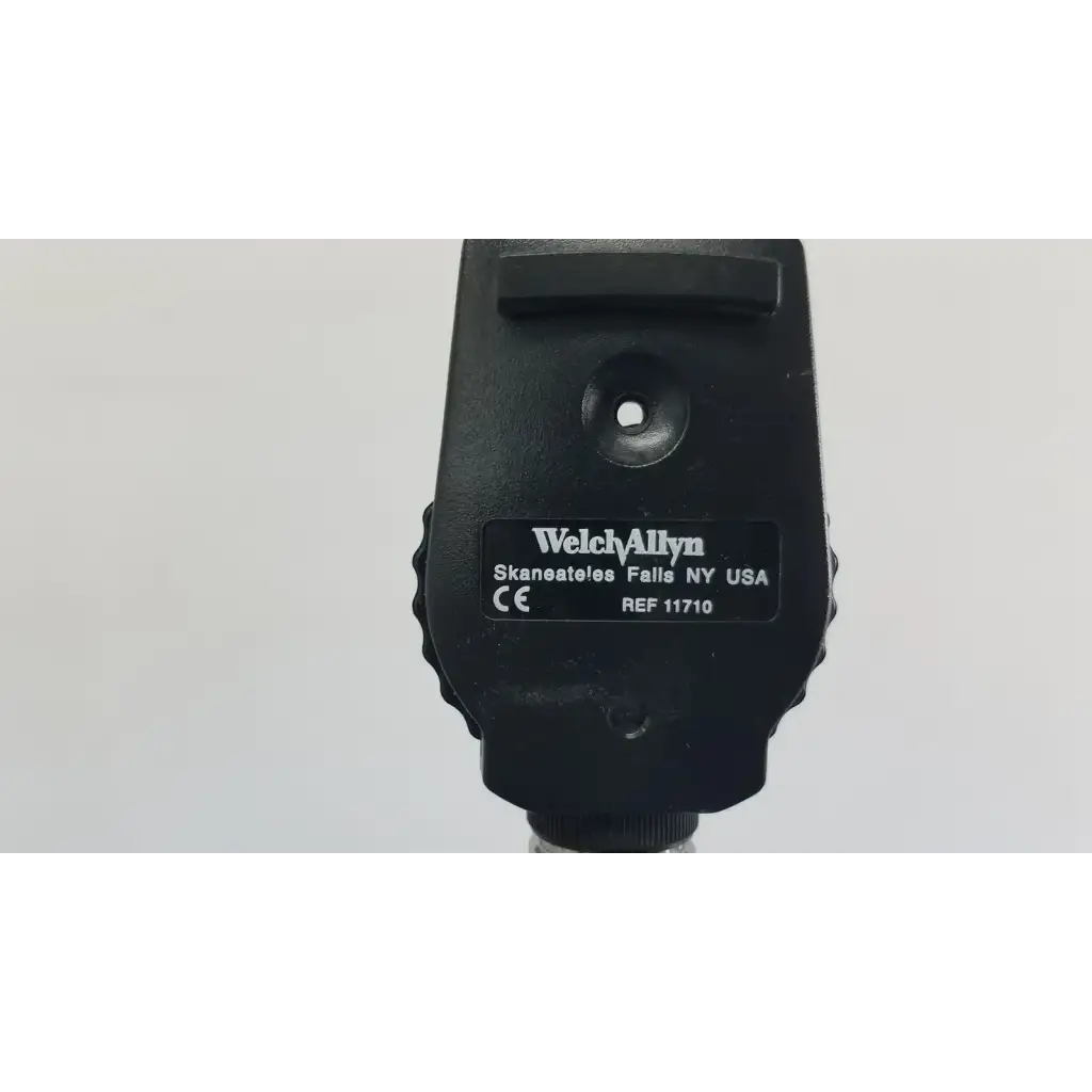 Black welch allyn ophthalmoscope with matte finish and textured grip included in wall transformer for reuse medical use