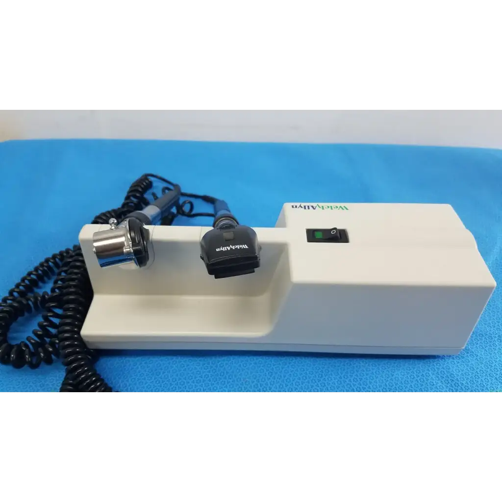 White rectangular Welch Allyn wall transformer with black coiled cables and coaxial ophthalmoscope metallic probe attachment