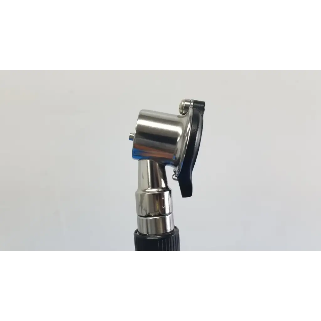 Silver metallic otoscope with black rubberized grip and adjustable headpiece in welch allyn wall transformer with coaxial ophthalmoscope