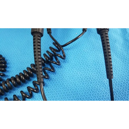 Black coiled cable with textured ribbed connectors for welch allyn wall transformer reuse medical applications