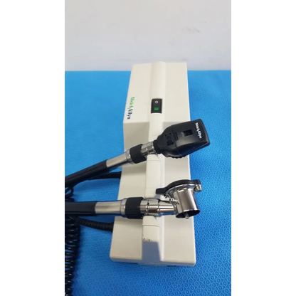 Welch Allyn 767 wall transformer with white and black coaxial ophthalmoscope featuring a sleek ergonomic design