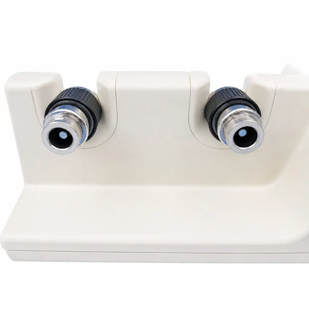 Cream-colored welch allyn 76710 diagnostic handle charging station with dual eyepieces for handle charging station use