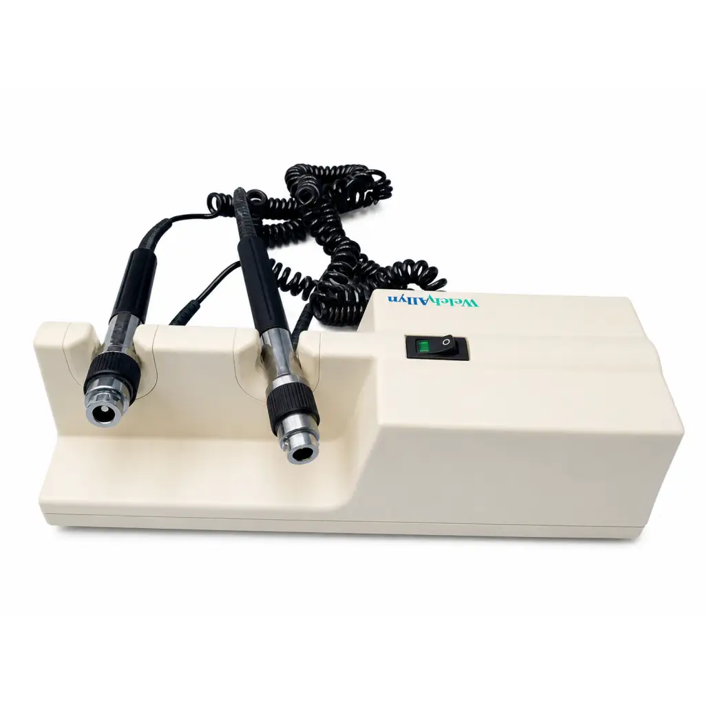 Cream-colored welch allyn 767 series transformer dental handpiece station with two black and silver diagnostic handles