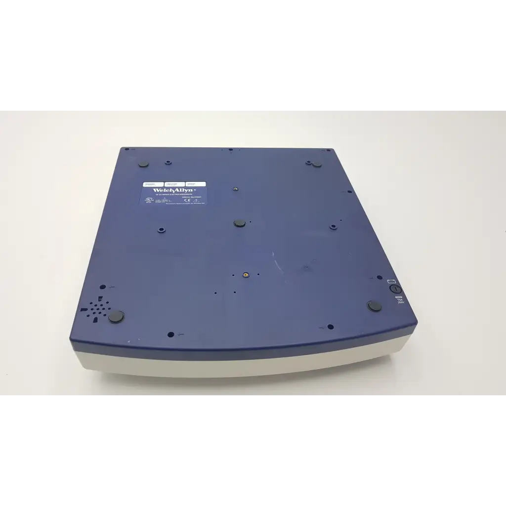Blue and white WadleyAllya scanner with sleek rectangular design on Welch Allyn CP10 EKG machine with leads