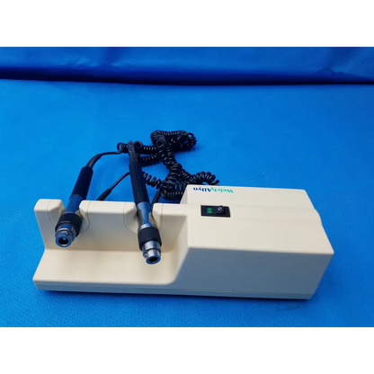 Cream-colored welch allyn diagnostic laser device with black-handled probes and coiled cables branded weldaly