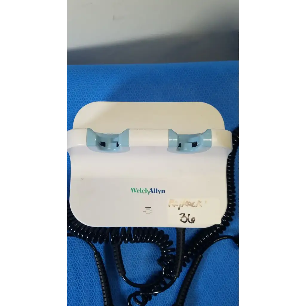 Welch allyn gs 777 wall transformer with white body light blue plastic grips and black coiled cords for reuse medical use