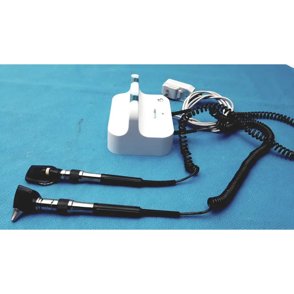 Welch allyn GS 777 wall transformer with white otoscope, black handles, and coiled cords for reuse medical use