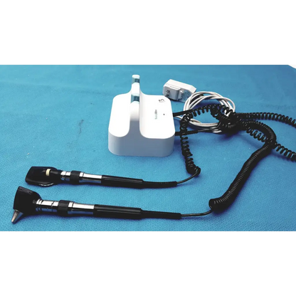 Welch allyn GS 777 wall transformer with white otoscope, black handles, and coiled cords for reuse medical use