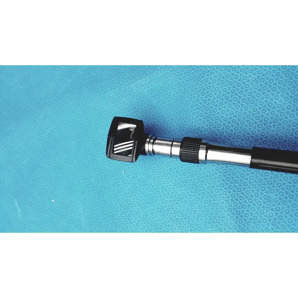 Welch allyn wall transformer with black and silver otoscope featuring a textured grip handle for reuse medical use