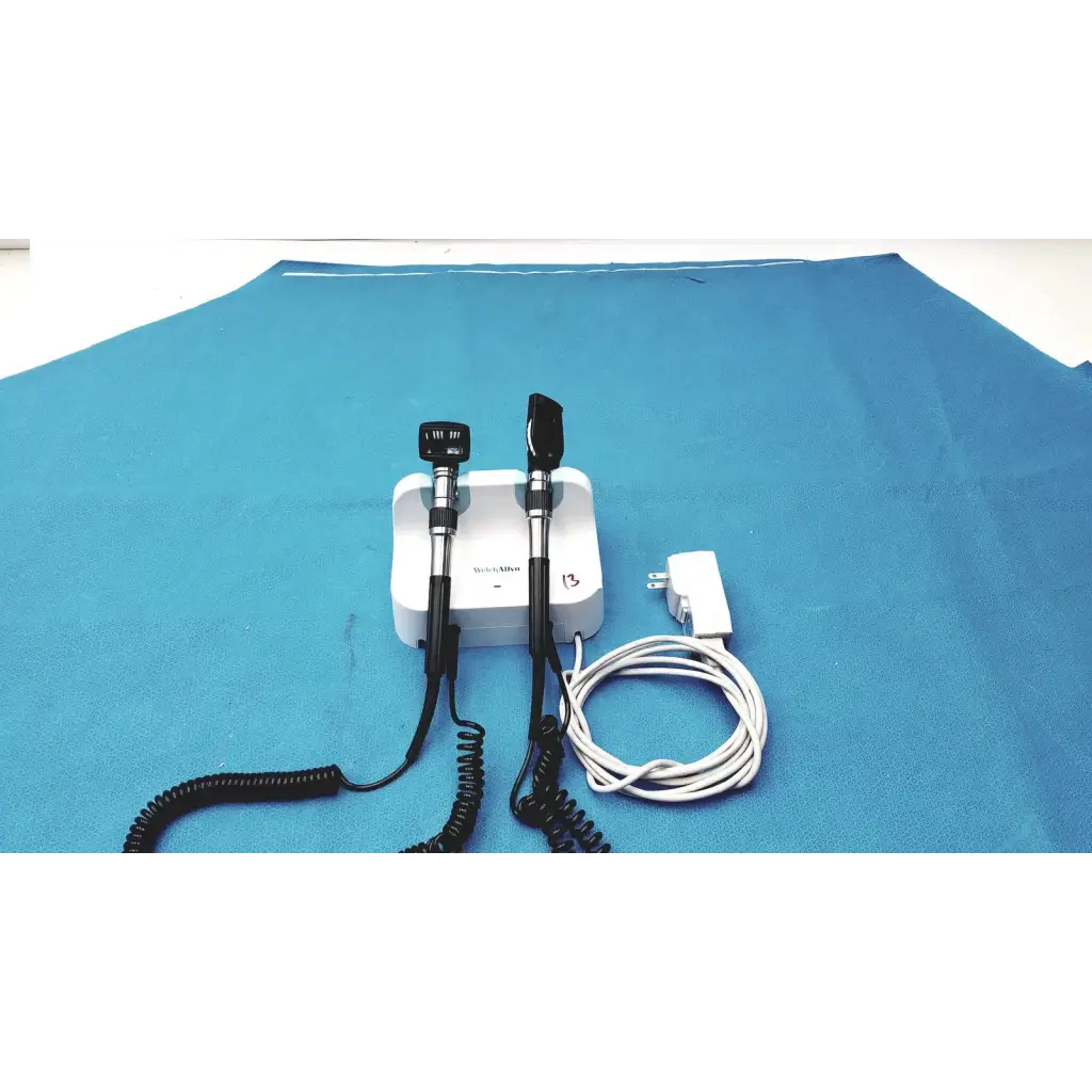 White medical otoscope with black handles and coiled cords for welch allyn wall transformer reuse medical use
