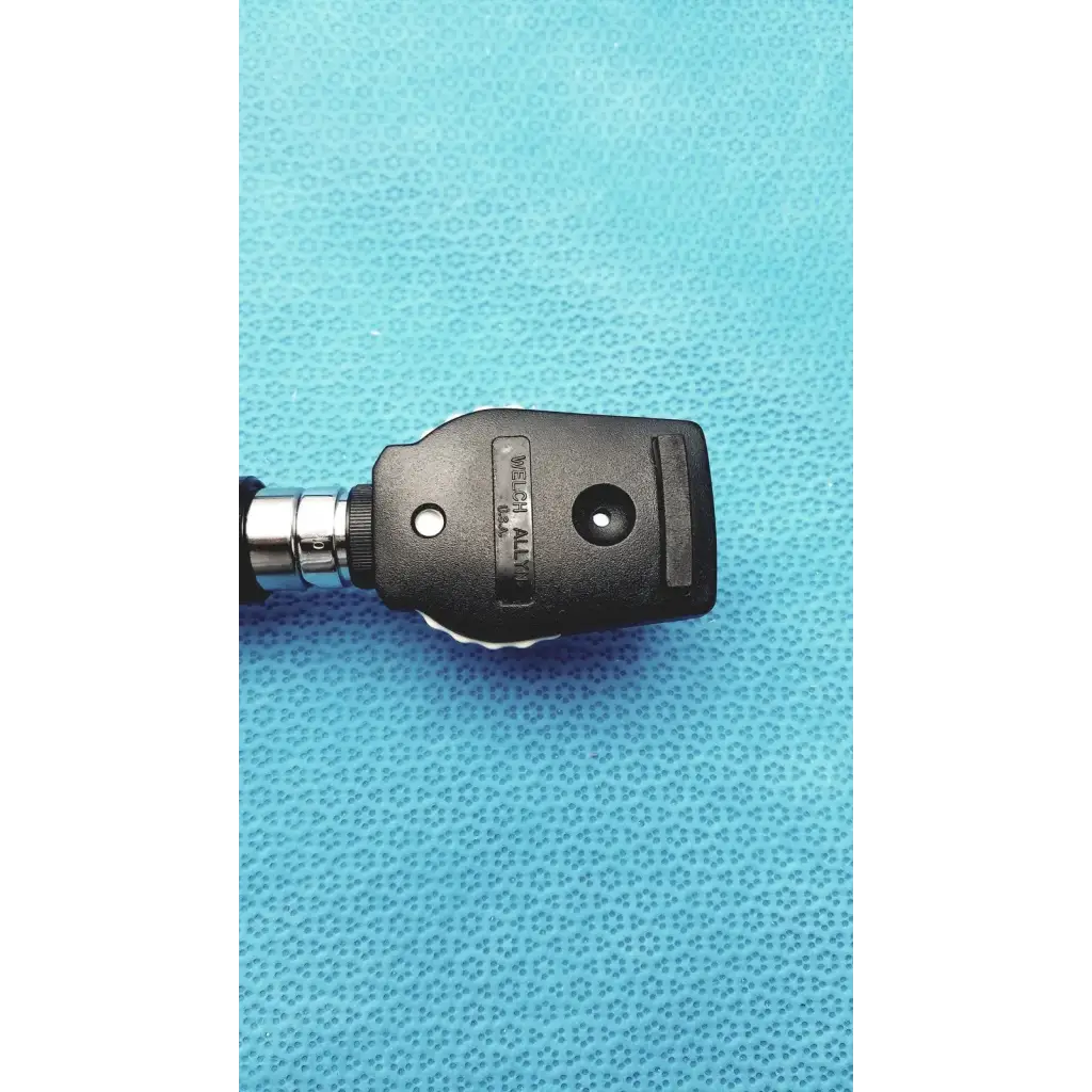 Black plastic and metal welch allyn ophthalmoscope head with textured grip for wall transformer reuse medical use